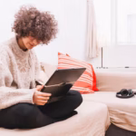 teenager-using-laptop-sofa_23-2147777274